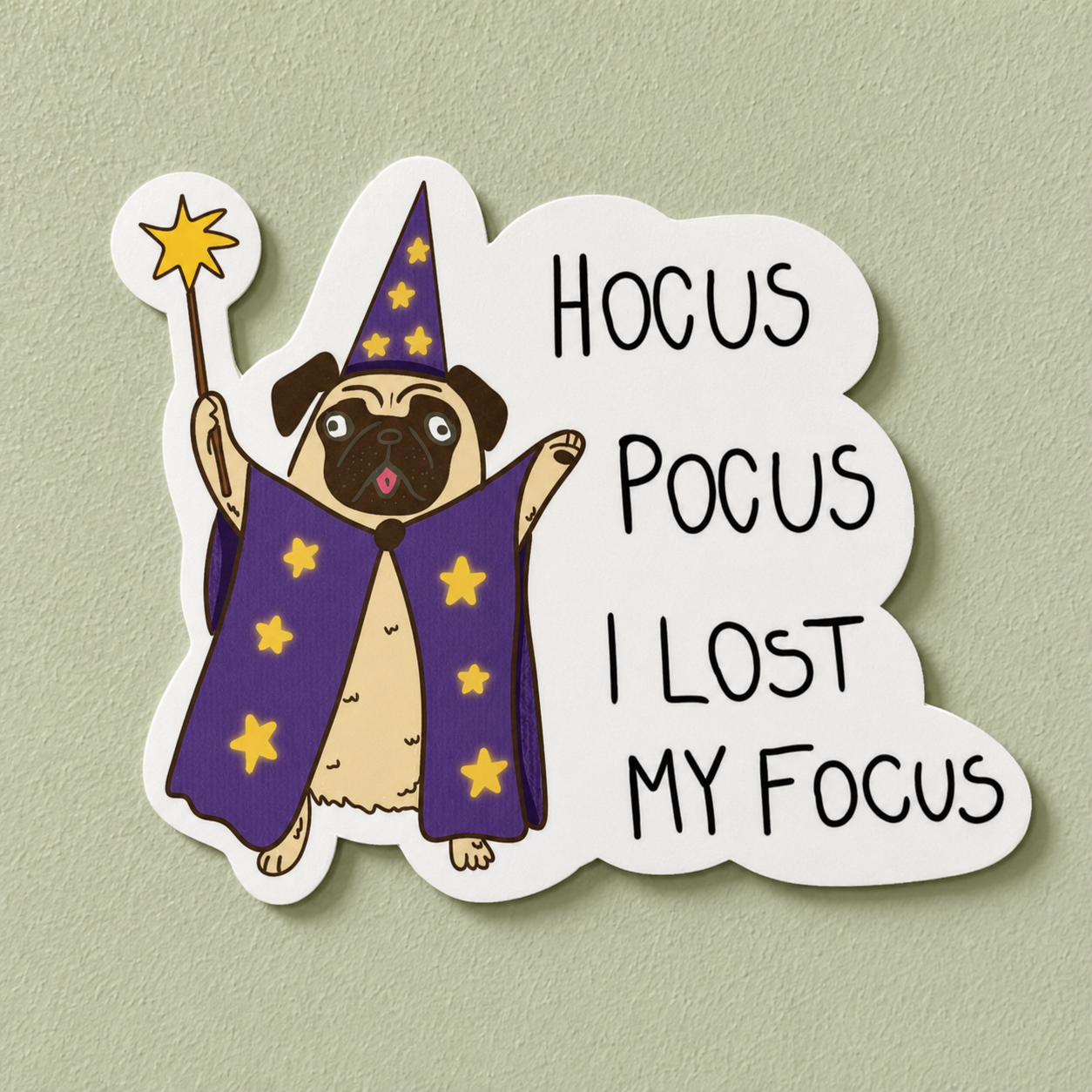 A die-cut sticker featuring a cartoon pug dressed as a wizard with a purple cape and star-spangled hat, holding a wand, next to the text 'HOCUS POCUS I LOST MY FOCUS' on a light sage green background.
