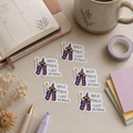 Five die-cut stickers featuring a cartoon wizard with a purple robe and gold hat, accompanied by the text 'HOCUS POCUS I LOST MY FOCUS', arranged on a beige desk with stationery props including a notebook, mug, washi tape, and sticky notes.